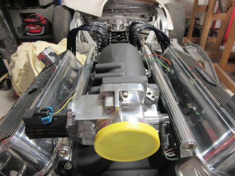 V8 engine with chrome valve covers and black intake manifold