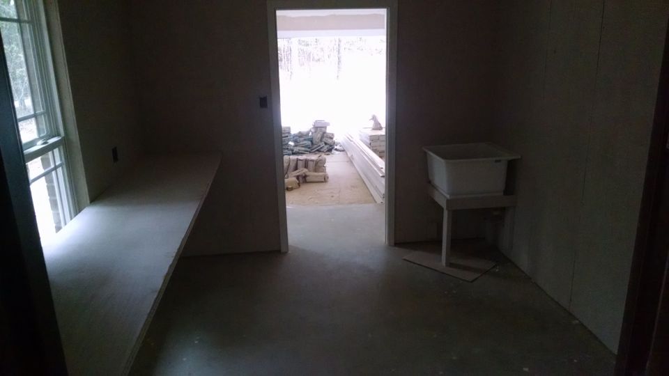 Utility room looking east.

While they were working on trim, I built the bench & painted the utility room walls.