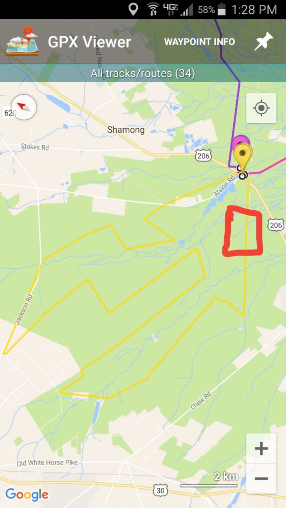 Screenshot of a GPS map showing a route with roads and forested areas.