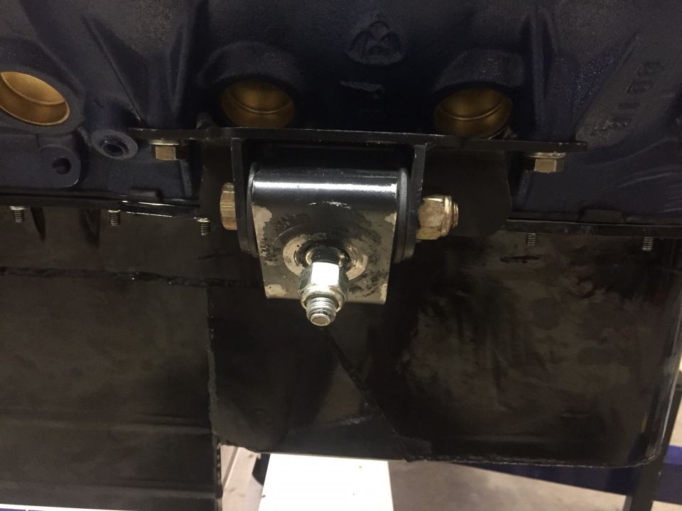 Engine block with black metal motor mount bracket and bolt