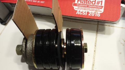 1976 Ford Ranchero - Close-up of suspension bushings, possibly for a vehicle part replacement.