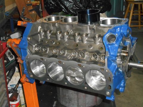 1972 Ford Bronco - Ford V8 engine block with pistons visible, mounted on an engine stand.