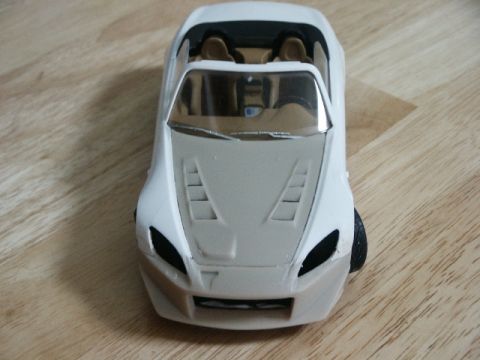 1998 Mercury Sable - A white model car is shown from the front, a tan interior and vents on the hood.