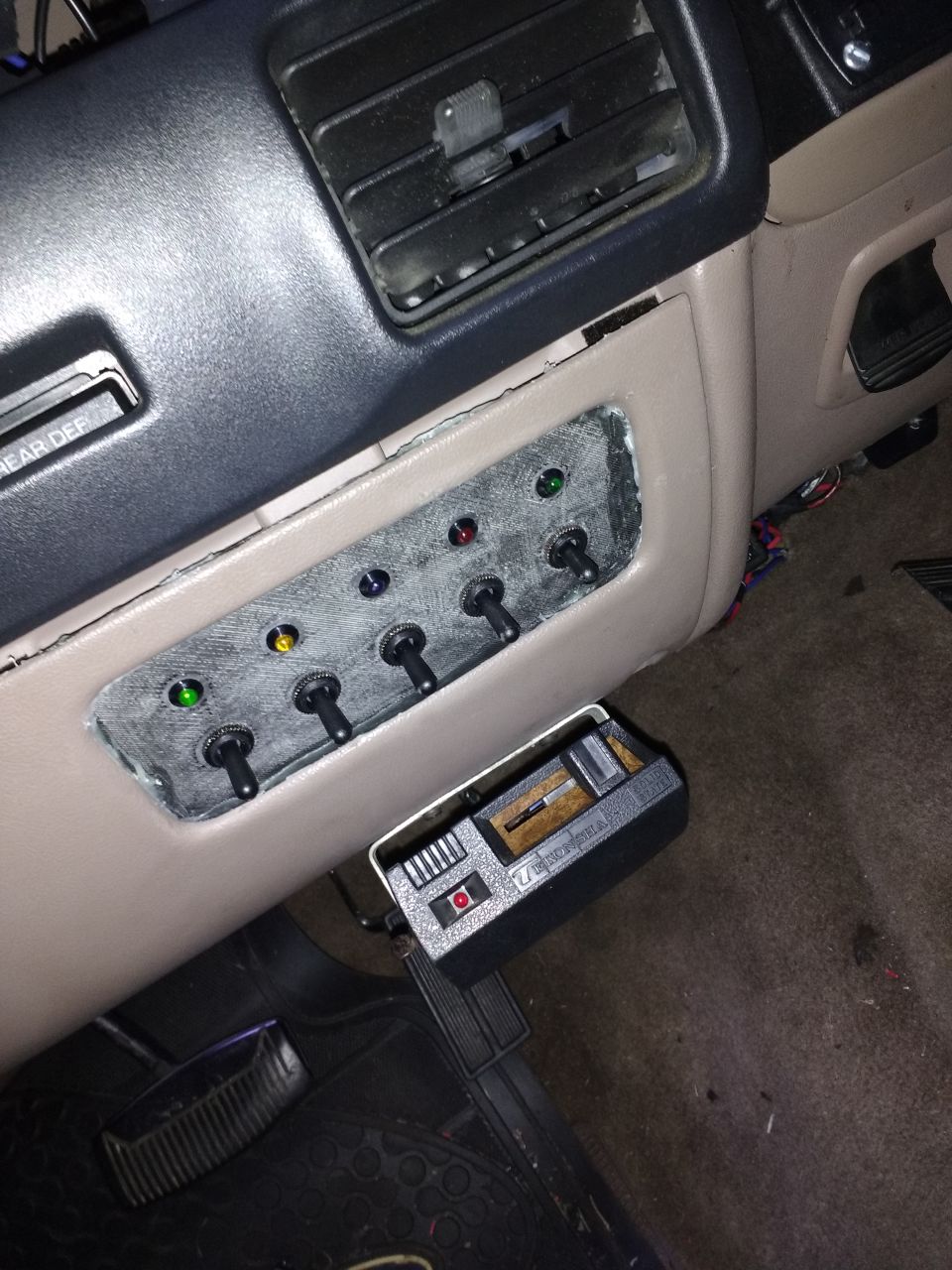 Here it is all glued in, it looks messy but I have since cleaned up the glue and added black rubber stripping around it.