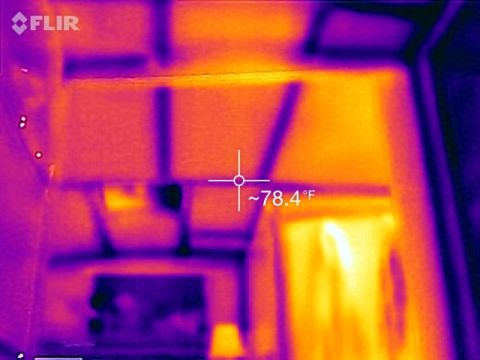 1995 Chevrolet P30 1 Ton - Step Van - This is a thermal image of what appears to be the interior of a structure, possibly a room or attic space, showing varying temperature grad…