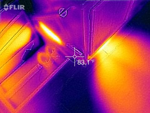 1995 Chevrolet P30 1 Ton - Step Van - This is a thermal image showing a bright yellow and orange area indicating heat, with purple and dark blue areas indicating cooler temperat…