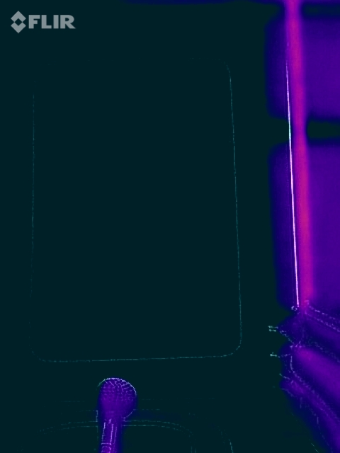 1995 Chevrolet P30 1 Ton - Step Van - A close-up, thermal image shows a purple microphone in the lower left corner, with a dark teal background that appears to be the interior o…