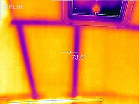 1995 Chevrolet P30 1 Ton - Step Van - This is a thermal image showing a section of a wall with visible structural elements and a window frame. A temperature reading of 73.6°F is…