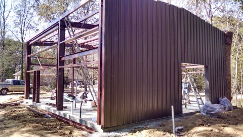 2004 Land Rover Land Rover - The East wall sheeting went on quickly because there's only 1 framed opening in it.
