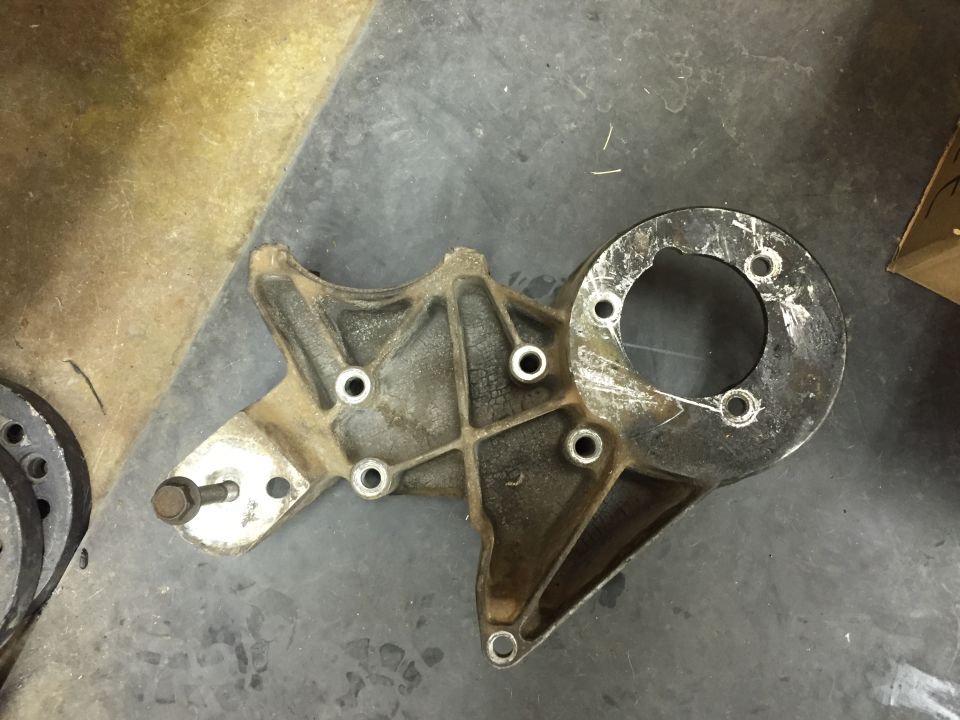 Cast aluminum bracket with circular flange and bolt holes