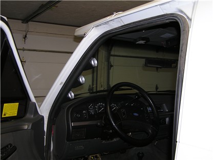 1993 Ford Bronco - Interior view of a 1993 Ford Bronco, showing the dashboard and aftermarket gauges.