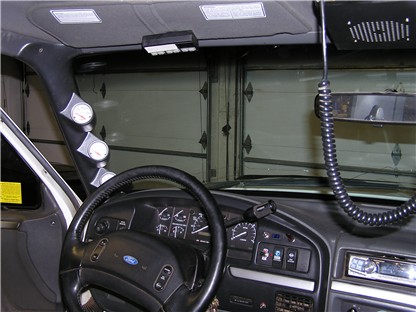 1993 Ford Bronco - Interior view of a 1992 Ford F-Series truck, aftermarket gauges on the A-pillar.