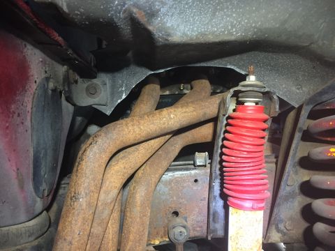 1978 Ford Bronco - Undercarriage view showing exhaust manifold and suspension components.