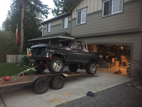 1978 Ford Bronco - This 1978 Ford Bronco is being transported on a trailer, showing its lifted stance and missing front end.