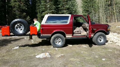 1996 Ford Bronco - This 1996 Ford Bronco is equipped for an off-road adventure with a rear-mounted spare tire and two red gas cans.