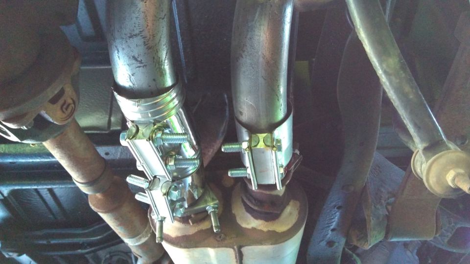 Here's my redneck install for the second pipe; ugly but it works. I have another coupler u-bolted to the muffler, then a flex pipe running to the tailpipe to create the right angle I wanted. Everything is secured with band clamps and gasket rtv once again.