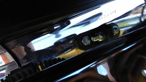 1996 Ford Bronco - Close-up view of a chrome push bar, showing mounting hardware and rubber dampeners.