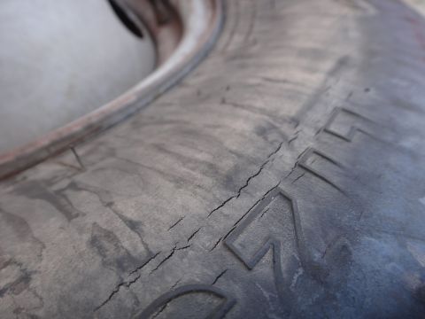 1995 Chevrolet P30 1 Ton - Step Van - This tire shows significant cracking and signs of dry rot, indicating it may need replacement.