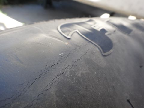1995 Chevrolet P30 1 Ton - Step Van - Tire sidewall shows significant cracking, indicating wear and potential failure.