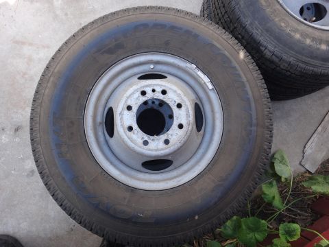 1995 Chevrolet P30 1 Ton - Step Van - Close-up of a dually truck wheel and tire, likely for a heavy-duty application.