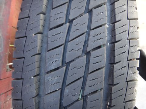 1995 Chevrolet P30 1 Ton - Step Van - Tire tread detail, showing wear pattern and a nail embedded in the rubber.