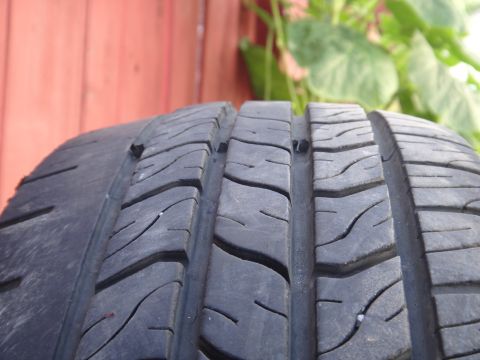 1995 Chevrolet P30 1 Ton - Step Van - The tread on this tire shows some wear and has small objects stuck in it.