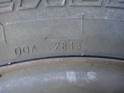 1995 Chevrolet P30 1 Ton - Step Van - Close-up of a tire sidewall showing the DOT code 2813, indicating the week and year of manufacture.