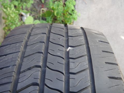 1995 Chevrolet P30 1 Ton - Step Van - A tire tread is shown with a nail stuck in it, indicating a potential puncture.