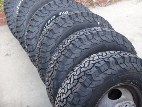 1995 Chevrolet P30 1 Ton - Step Van - Close-up view of multiple BFGoodrich All-Terrain T/A tires arranged in a row.