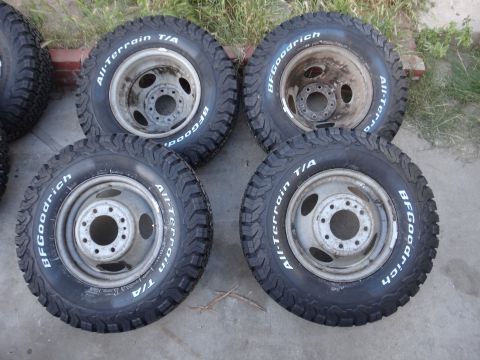 1995 Chevrolet P30 1 Ton - Step Van - Four BFGoodrich All-Terrain T/A tires mounted on steel wheels are displayed on a paved surface.