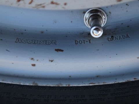 1995 Chevrolet P30 1 Ton - Step Van - A close-up view of a vehicle's wheel rim, showing manufacturer markings and a valve stem.