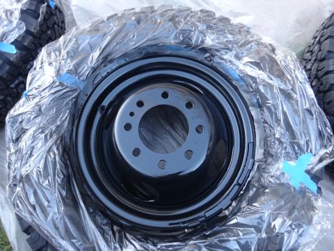 1995 Chevrolet P30 1 Ton - Step Van - Wheel and tire assembly covered in plastic wrap, likely for protection or storage.