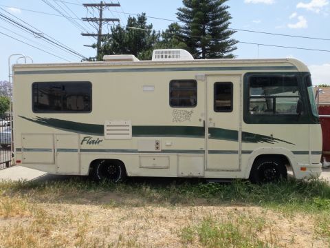 1995 Chevrolet P30 1 Ton - Step Van - This RV features a "Flair" decal and a graphic of the United States on its side.