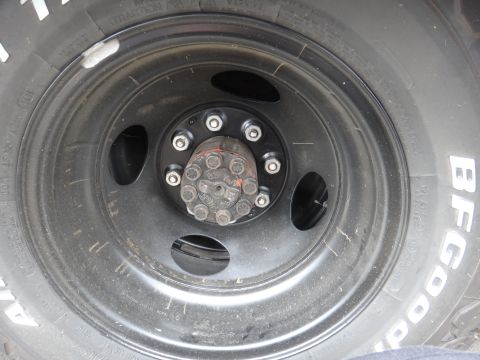 1995 Chevrolet P30 1 Ton - Step Van - Close-up of a heavy-duty wheel hub and tire, likely from a truck or van.