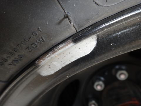1995 Chevrolet P30 1 Ton - Step Van - A close-up view of a tire and wheel rim, showing some wear and markings on the tire sidewall.