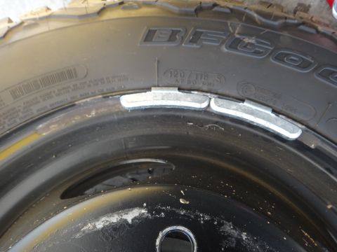 1995 Chevrolet P30 1 Ton - Step Van - Close-up of a wheel and tire assembly with visible wheel weights.
