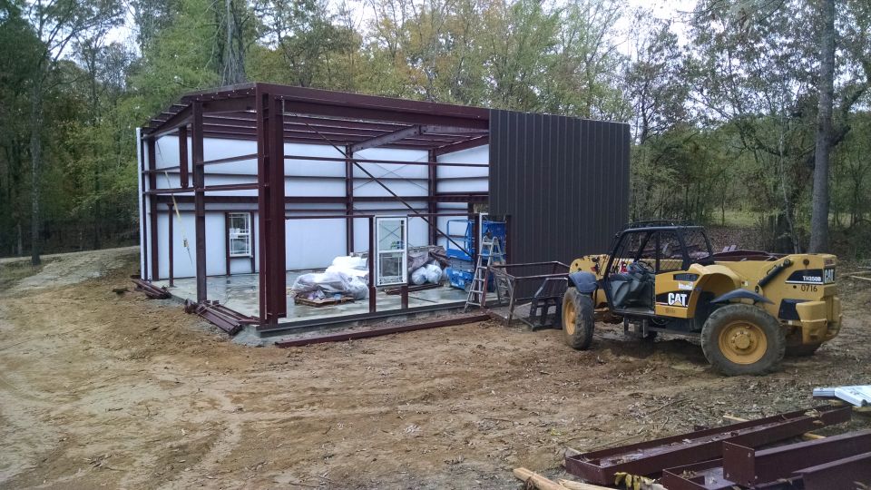 The South sheeting took a lot longer than the others because of the 3 framed openings (1 sheeted over for now).