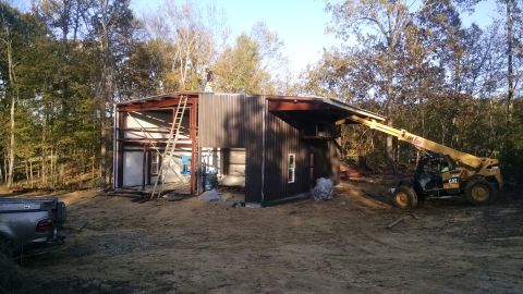 2004 Land Rover Land Rover - West sheeting is started, and the roof is complete. They plan to finish tomorrow.