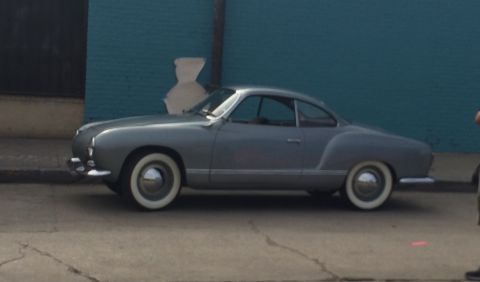 1968 Ford Mustang - This classic coupe, likely a Volkswagen Karmann Ghia from the mid-1950s, is seen from the side.