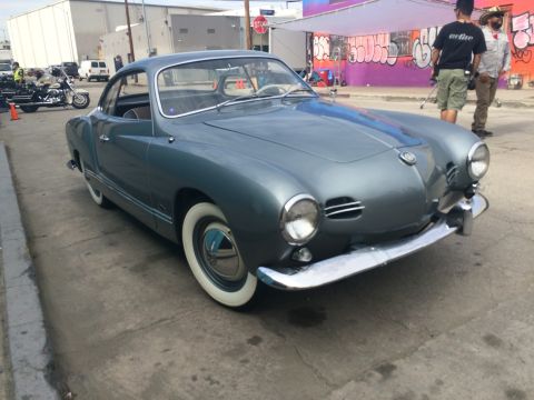 1968 Ford Mustang - This classic Volkswagen Karmann Ghia coupe is parked on a city street.