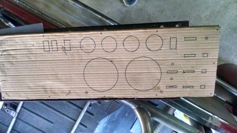 1985 Jeep CJ7 - A piece of cardboard with various shapes and rectangles drawn on it, likely a template for cutting holes in a vehicle's dashboard or panel.