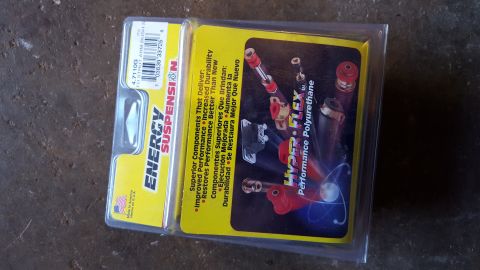 1994 Ford Bronco - A packaged set of Energy Suspension Hyper-Flex Performance Polyurethane parts, likely for a 1994 Ford Bronco, is displayed against a textur…