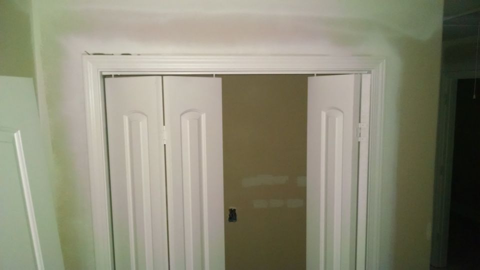 The painters put down the first full coat, but over a lot of sheetrock problems, and over a lot of door hardware, which is now ruined.