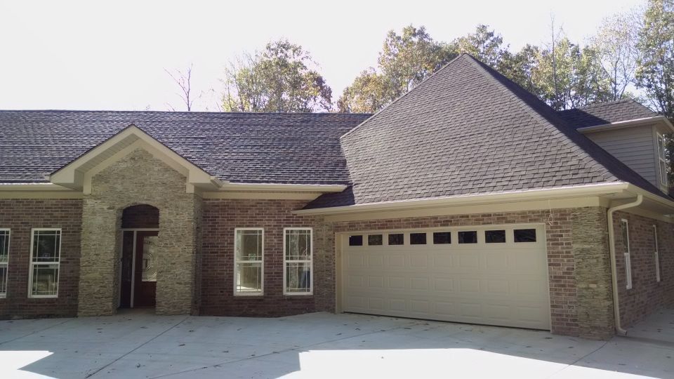 The garage door is partially installed; the caming & insulation are missing, though.