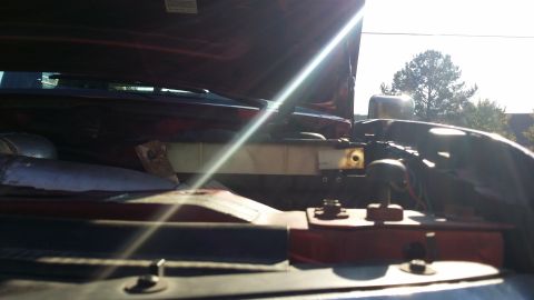 1996 Ford F-250 - Showing clearance between reservoir and hood. It looks tight but as far as I can tell, not hitting. Here you can also see how I mounted the…