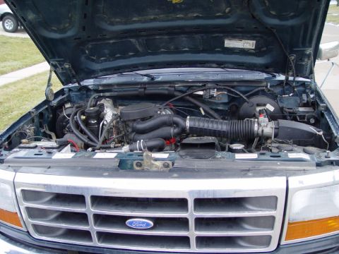 1995 Ford Bronco - Engine bay view of a 1995 Ford Bronco, highlighting the V8 engine and front grille.