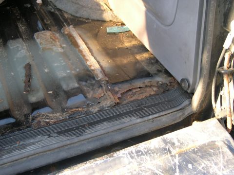1994 Ford Bronco - some of the damage that the broken hanger did, there is a dent, and it helped seperate the floor from the back of the body. should be an ea…