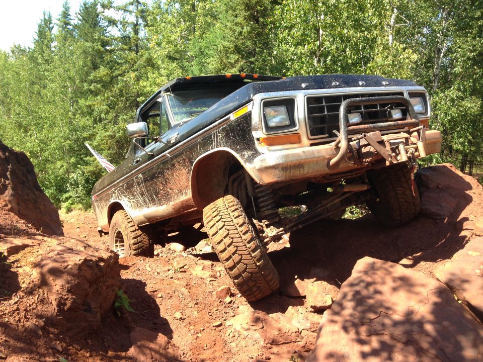 1979 Ford Bronco on a rocky off-road trail.