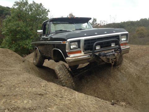 1979 Ford Bronco - This black 1979 Ford Bronco navigates a challenging off-road course, its capabilities.