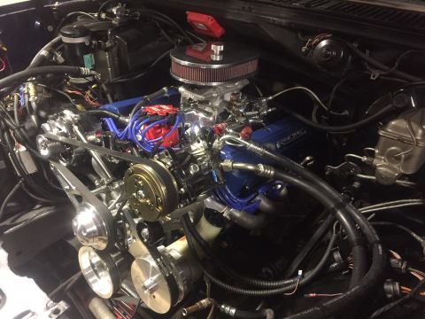 1982 Ford Bronco - A detailed view of a modified V8 engine, custom components and wiring.